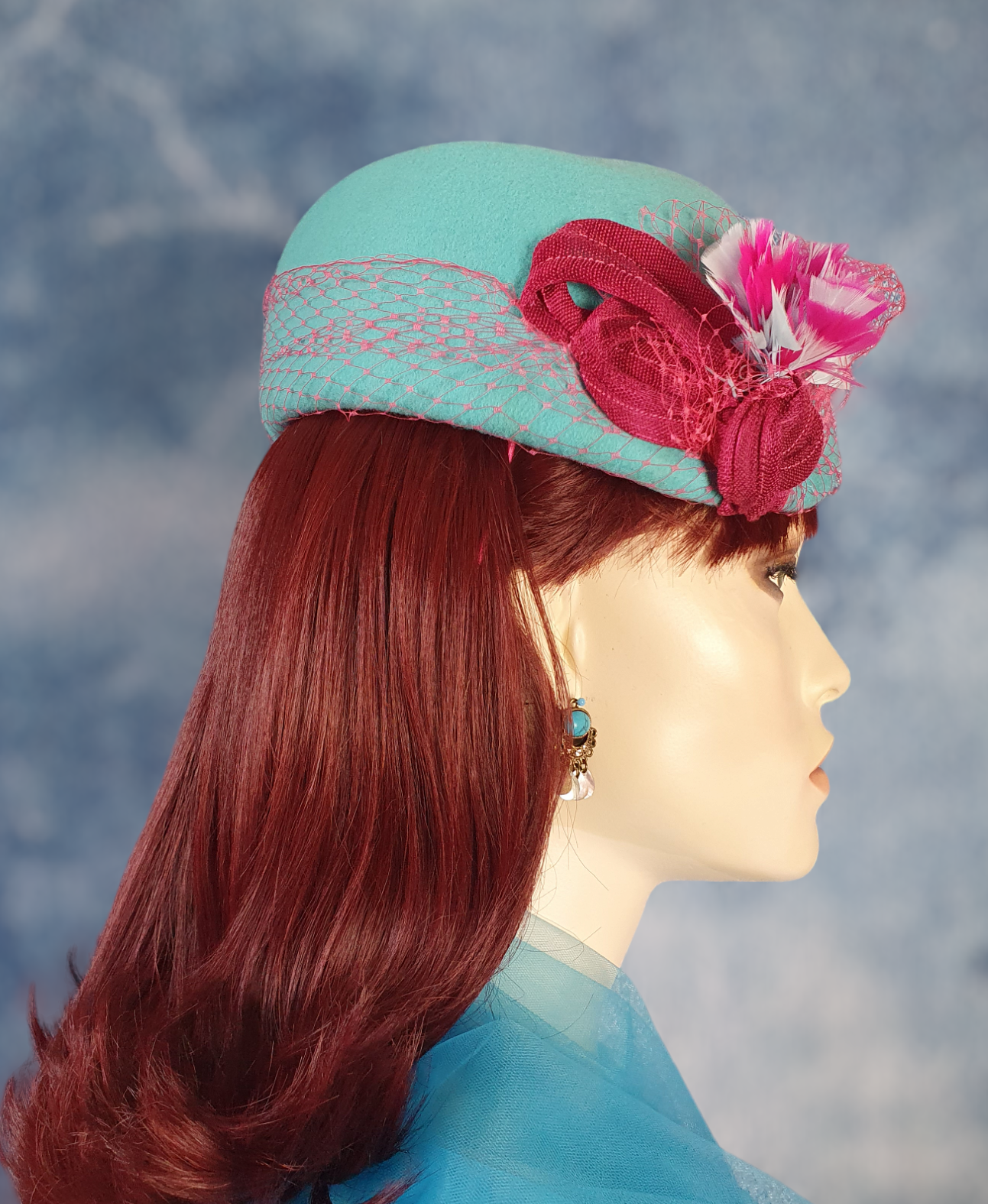 Handmade blue felt fascinator with pheasant feathers and abaca silk, elegant vintage pillbox women's hat for special occasions.