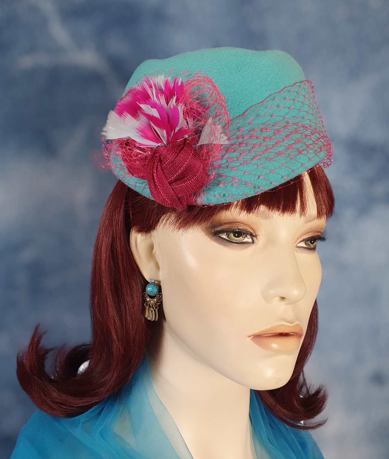 Handmade blue felt fascinator with pheasant feathers and abaca silk, elegant vintage pillbox women's hat for special occasions.