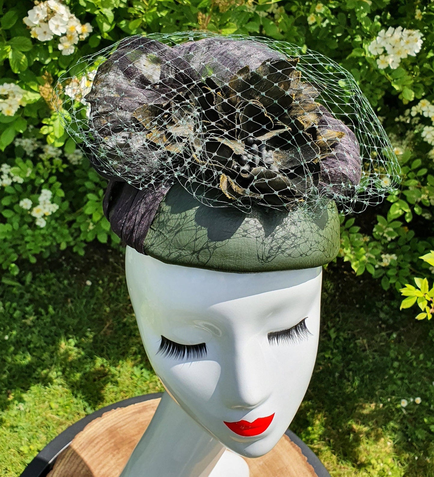 Handmade fascinator green with black made of natural leather, women's headpiece, guest dress - for a wedding or special occasion.