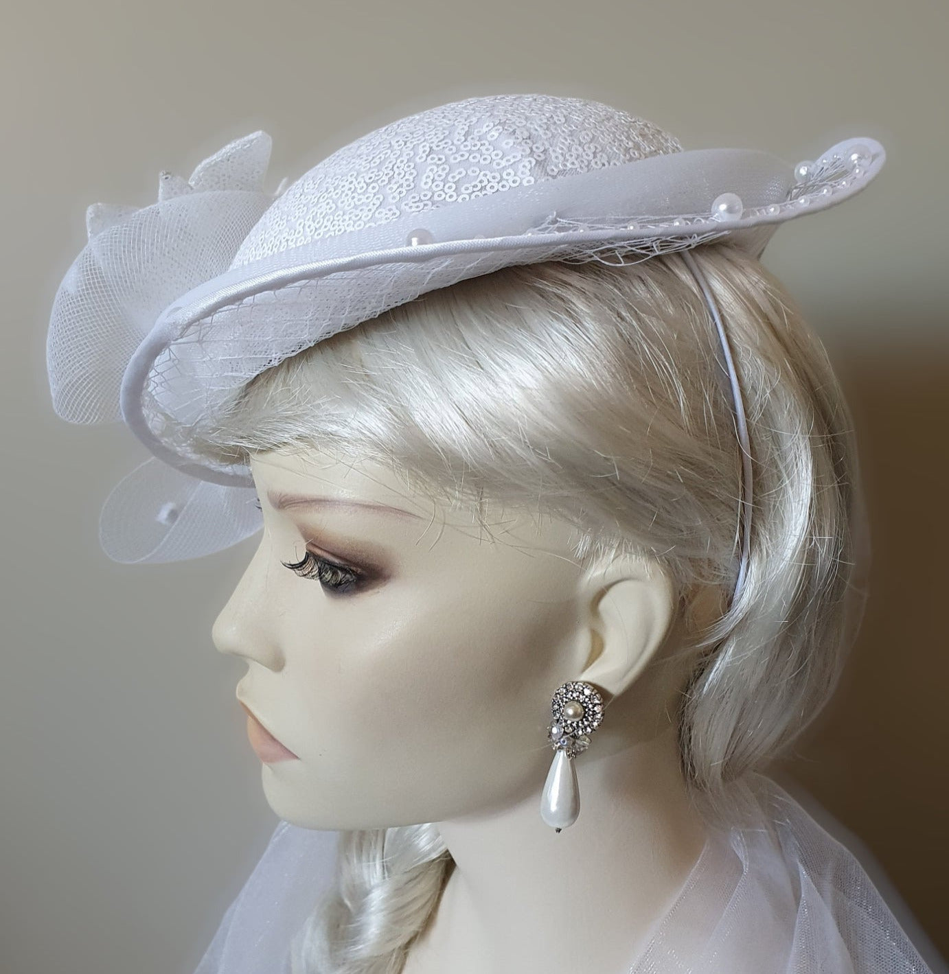 Handmade fascinator made of sequin crinoline material with veil - perfect for weddings and festive occasions